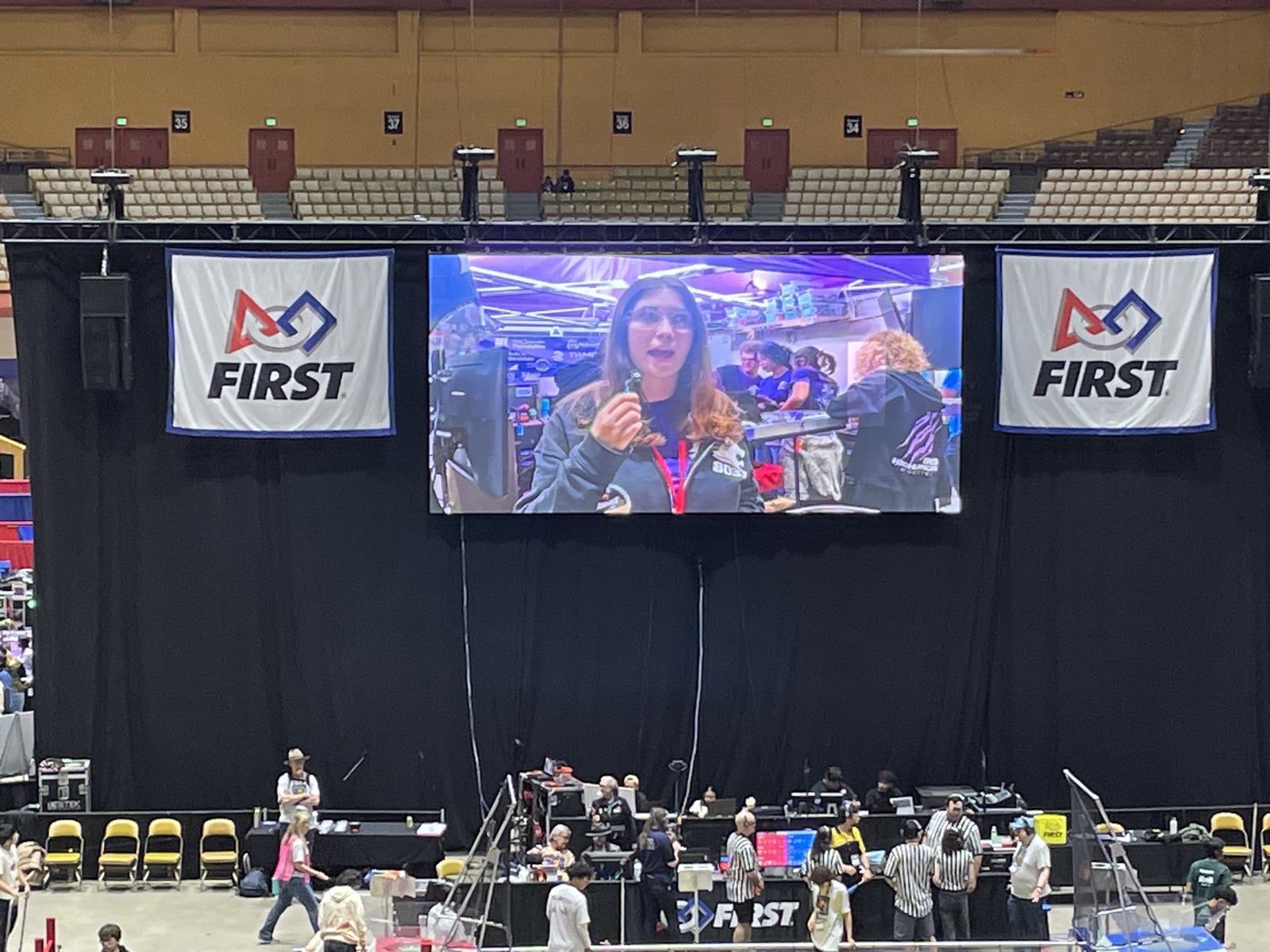 Captain Cassie Colby on the big screen at the Nor Cal District Championship event, talking about Highlander Robotics' new 10th Street practice field
